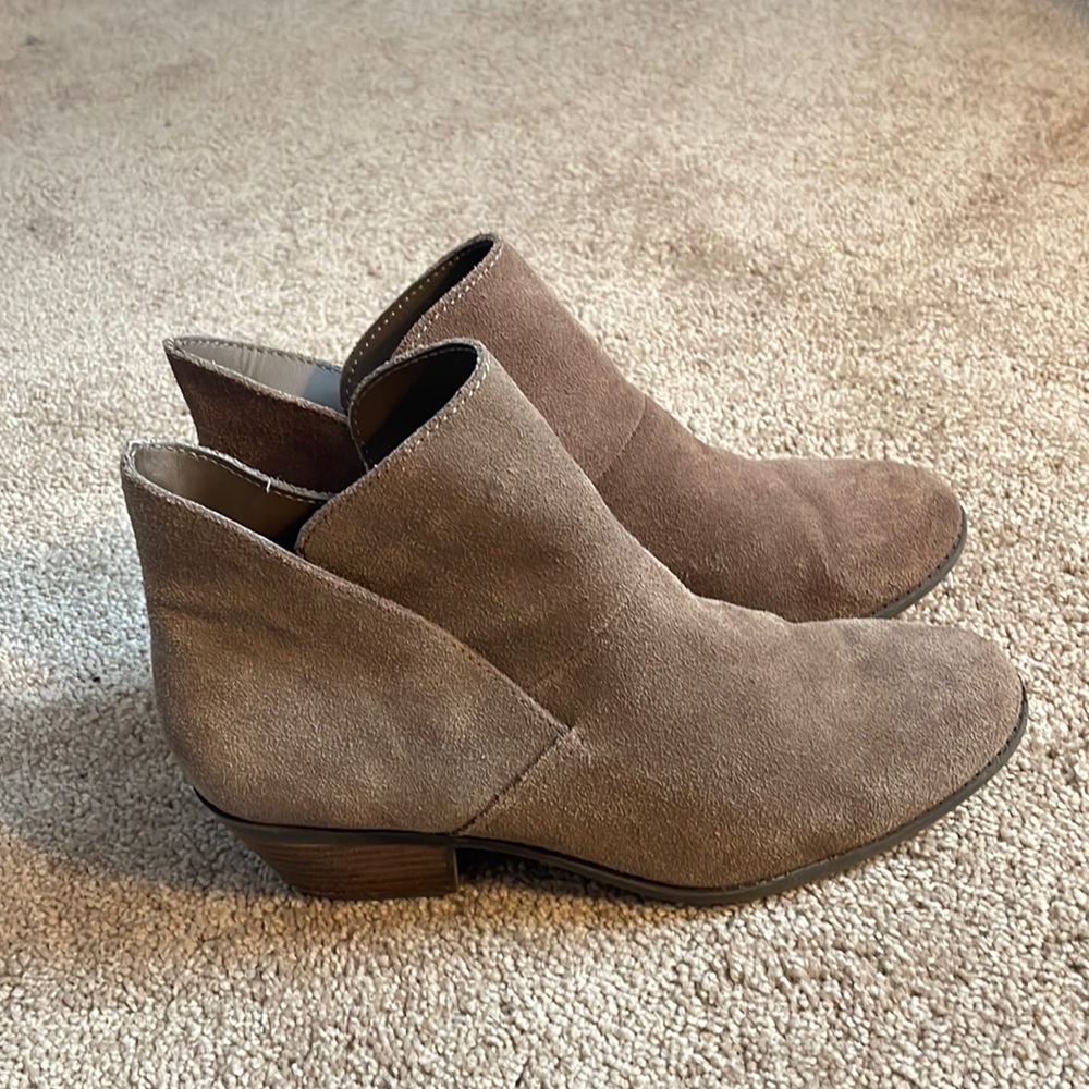 Brown heeled suede booties.